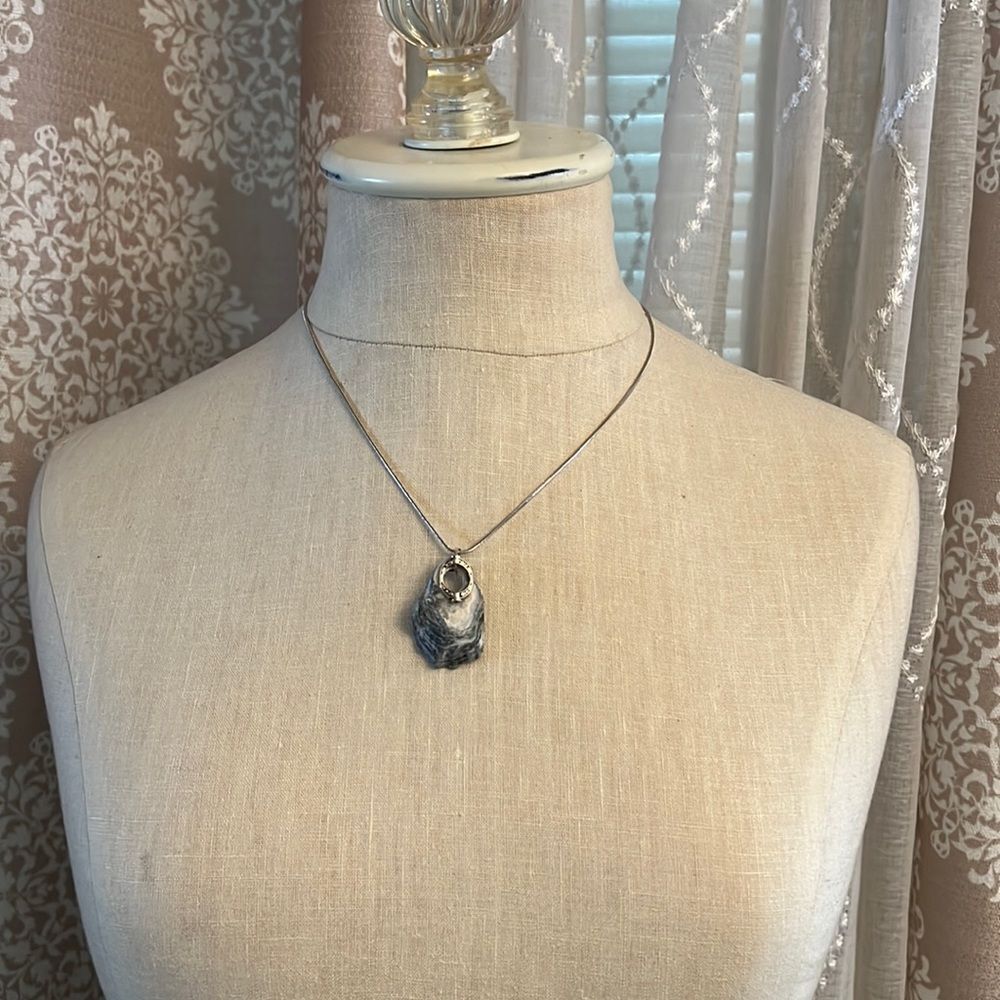 Handcrafted natural seashell Pendant Necklace on an 18 in. silver tone necklace.